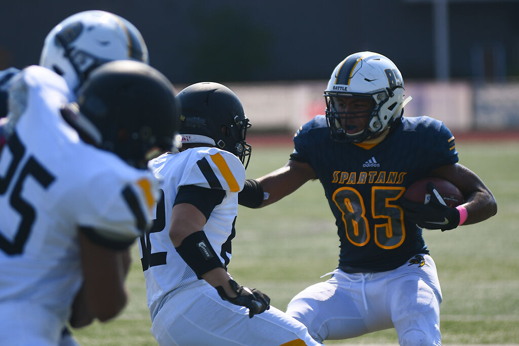 Battle tight end Tyson Ellison protects the ball